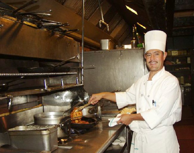 Gulliver's chef cooking on the line in the restaurant kitchen