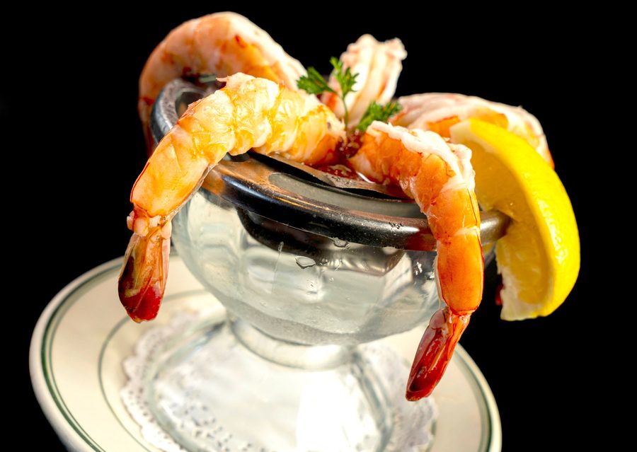 Gulliver's jumbo shrimp cocktail with lemon in a chilled glass