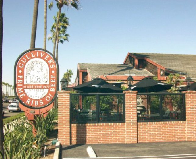 Gulliver's Restaurant building, crest sign and patio on MacArthur Blvd in Irvine